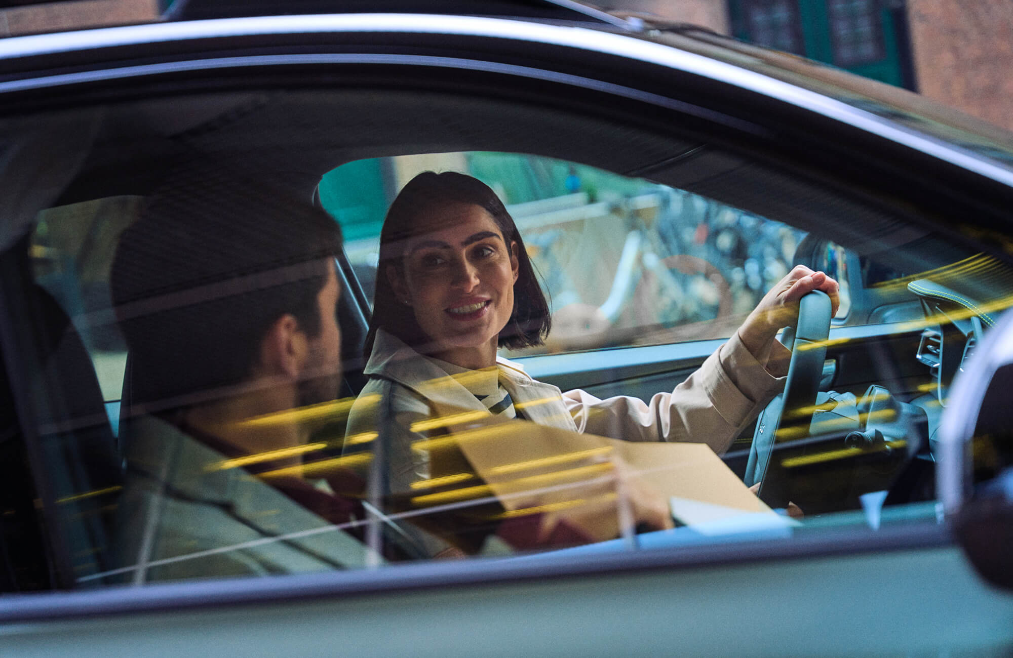 Woman driving and smiling