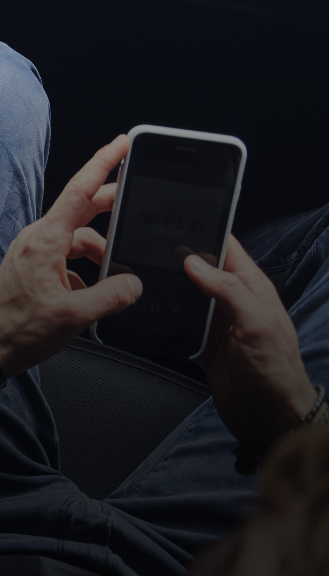 Person using their phone in the passenger seat 